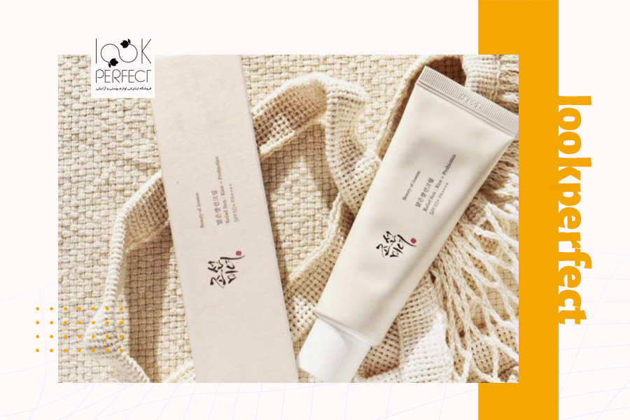 تصویر کرم ضدآفتاب بیوتی آف جوسان با بسته‌بندی و طراحی کره‌ای روی پارچه کنفی روشن